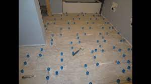 Laying large floor tiles level. How To Use Progress Profiles Proleveling System To Install Large Format Tile Youtube