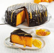A Moist And Gooey Orange Sponge With Pockets Of Sticky Orange Curd Smothered With Rich Choc Sticky Orange Cake Recipe Orange Cake Recipe Orange Chocolate Cake