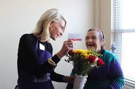 You get to create a work of art and then give it away to a random person. Lupe Krantz Thrilled To Receive A Bouquet From Random Acts Of Flowers Chicago Executive Director Joanie Bayhack 500x333 Chicago Methodist Senior Services