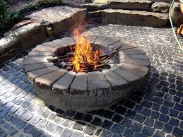 Your fire pit will take the shape of any type of large plastic container you choose, such as a flowerpot or urn. How To Build A Round Stone Fire Pit Fire Pit Backyard Stone Fire Pit Outdoor Fire Pit