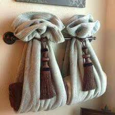 For a pop of color, choose a roller in a contrasting shade to your bathroom's color scheme. Ways To Decorate The Towel Racks In Your Bathroom Bathroom Towel Decor Decorative Bath Towels Hang Towels In Bathroom