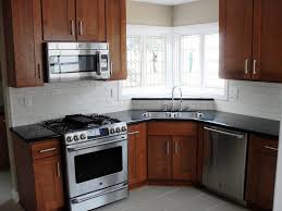 white subway tile backsplash. black