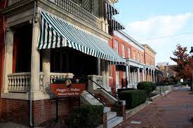 Red Brick Row Houses With Green Striped Awning On House In Foreground Historical Sites National Parks Walker House