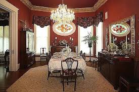 The victorian dining room offers a round dining table and blue upholstered chairs that complement the wainscoted walls and cabinetry. Victorian Style House Dining Room At Home Pinterest Dining Room Victorian Victorian Style House Victorian Style Decor