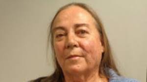 Son defends mother charged in a murder-for-hire case