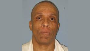 Man serving life for deadly stabbing at a barbecue dies in Alabama prison