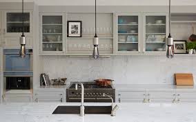 The theme of decorating the room with white dining table showcase is adopted for giving the rooms a brighter look. Glass Kitchen Cabinets For A Stylish Modular Kitchen Beautiful Homes