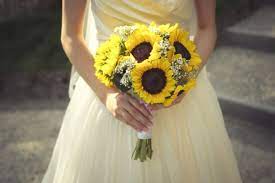At her cozy fall wedding, bride sonny carried a bouquet of creamy dahlias, anemones, ranunculus, astilbe, silver bell eucalyptus, and geranium foliage. The Best And Worst Wedding Flowers By Season