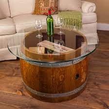 The artisans at alpine wine design took great care to preserve and enhance the natural beauty of this solid oak wine barrel while crafting it into a table, featuring a glass top and a beautiful collection of corks. Glass Top Crate Coffee Table Napa East Wine Country Accents
