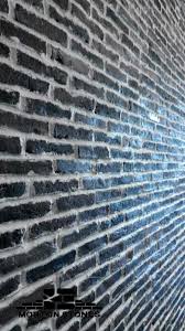 The first one is more complicated the other one is more simple. Black Brick Veneers For Beautiful Brick Walls Brick Wall Decor Brick Veneer Brick Tile Wall