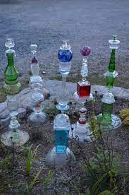 Adorable hanging gutter planter and stand. 21 Creative Diy Glass Garden Flowers Yard Art Glass Garden Art Glass Garden Flowers