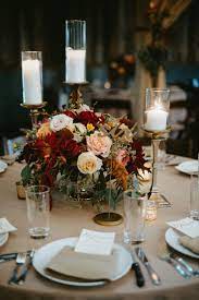 Candles And Floral Centerpiece Wedding Table Centerpieces Wedding Centerpieces Wedding Candles Table