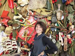 Siopis used lacquer and oil paint to create the distressed and excited look, along with phrases from rubber stamps found at a children's craft store. Datei Penny Siopis In Front Of Her Installation Charmed Lives Jpg Wikipedia