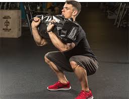 The 4 Simplest Hardest Workouts You Ve Never Tried Bodybuilding Com Sandbag Training Sandbag Workout Hard Workout