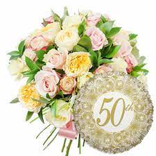 Send beautiful flower arrangements to brighten someone's day! Order A Happy Golden Anniversary Combo With Handy Flowers Today