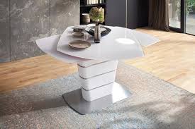 This swiveling dining chair is durably constructed from rubberwood and oak veneers. Asberelda White High Gloss And White Glass Swivel Dining Table 140cm 200cm