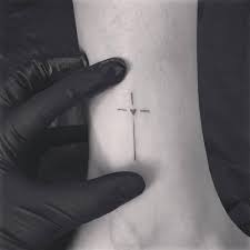 This may be the worlds smallest rosary but no one says cross tattoos have to be large. Top 63 Best Cross Tattoo Ideas For Women 2021 Inspiration Guide