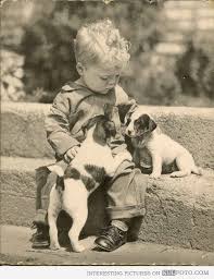 This podcast is about reading nice books to puppies and kids. Cute Kid Playing With Two Puppies Old Photo Vintage Children Photos Vintage Dog Cute Kids