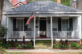 The Brickhouse Cottage 503 S Front St This One Story Hip Roof Dwelling With Full Width Front Porch Was B Porch Design Ideas Gable Roof Design House With Porch