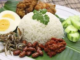 A light meal that is believed to be malay in origin, it is traditionally accompanied by fried anchovies, sliced cucumbers, fried fish known as ikan selar, and a sweet chili sauce. Nasi Lemak Traditional Rice Dish From Malaysia Southeast Asia