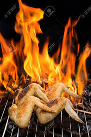 Place all of your chicken wings on the grill grate and begin your cook. Grill Concept Four Grilling Chicken Wings On Barbecue Grill With Fire On Background Selective Focus Stock Photo Picture And Royalty Free Image Image 56789327