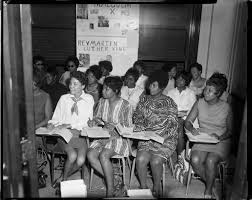 His hometown was atlanta and grew up their as a child with both his father and grandfather being pastors. Women Seated At Desks With Posters About Dr Martin Luther King Jr And Malcolm X In Background Possibly In Carnegie Library Of Pittsburgh East Liberty Branch Cmoa Collection