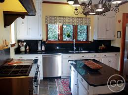 1930's knotty pine cabinets painted white