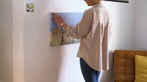 How to hang pictures on drywall without holes. How To Hang A Canvas Without Nails Or Damaging The Walls Youtube