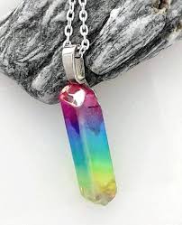 Maybe you would like to learn more about one of these? Aura Rainbow Quartz Crystal Pendant Felt