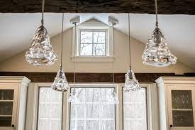 Lighting solutions for vaulted ceilings 1000bulbs com blog vaulted ceiling lighting ceiling lights diy sloped ceiling lighting. Wood Beams Vaulted Ceiling Glass Pendant Lights Studio 76 Kitchens Baths