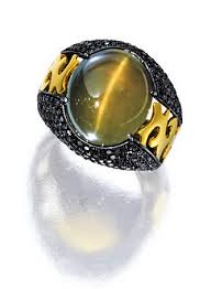 Cat S Eye Chrysoberyl And Black Diamond Ring Centring On An Oval Cabochon Cat S Eye Chrysoberyl Weighing 18 00 Carats To Cat Eye Jewelry Cats Eye Ring Jewelry