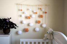 In a child's bedroom, mix timeless artwork with fun, youthful wall decor. Nursery Wall Decor Nursery Wall Hanging Kids Room Decor Pom Pom Decor Baby Girl Boy Room Decor Diy Nursery Decor Wall Hanging Diy Nursery Wall Decor