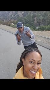 "I know it's going to be a lovely day when I start it with a sunrise hike  alongside my two loves—hubby and @storm_thestandardpoodle 🎶🌅 #LovelyDay  #FamilyTime #HikeLife #RunyonCanyon #SunriseHikes