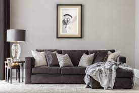 A Bold Colour Palette Of Dark Neutrals And Metal Accents Dark Grey Beige And Gold Contr Dark Grey Sofa Living Room Grey Sofa Living Room Living Room Designs