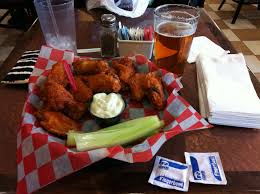 Seasoned and baked chicken wings (that are very tasty on their own) get a flaming hot bath in an extra spicy homemade buffalo wing sauce. Buffalo Wing Wikipedia