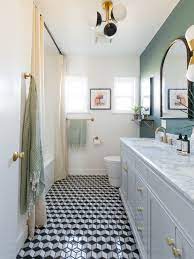 An oversized map pops against the emerald wall, while new tiles and fixtures pull the look together. These 11 Stylish Bathroom Remodel Ideas Are Brilliant