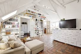 The exposed brick wall of this room via hot style design give an edgy industrial feel to the room. 39 Attic Living Rooms That Really Are The Best Adorable Home Com