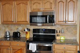 granite countertops and tile backsplash