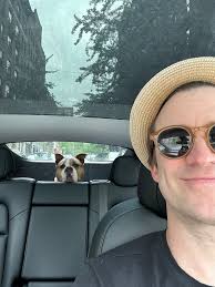 The 2025 Tony Awards in memoriam tribute sadly included our dear friend,  Gavin Creel. Here is a picture of Gavin and Nina, (formerly Athena) the dog  he adopted from us, happily driving