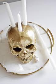 I could totally imagine making two of these to go on the side of a mantle or large piece of art. Skull Candle Holder Diy A Beautiful Mess