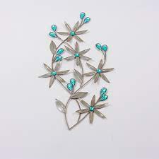 Get instant discounts · norton shopping guarantee · certified dealer Evie Teal Metal Wall Art Harry Corry Limited