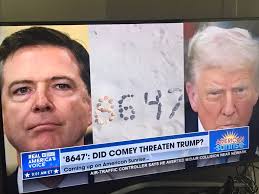 Are they all now wearing orange behind him so he's camouflaged from a  assassination attempt?