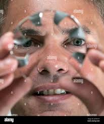 Dan Baxley holds up a Vortec Cyclone device, Tuesday, June 3, 2008, in  Rocky River, Ohio. The Vortec Cyclone can be inserted in a vehicle's air  intake line to improve fuel efficiency. (