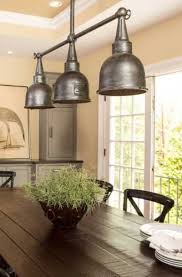 This pendant chandelier light is made to look like a candelabra with 10 candles that cast a beautiful glow to the coffee table below it. 21 Awesome Industrial Lighting Ideas Sebring Design Build