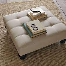 The beanbag coffee table measures 31″ square and is 11″ tall. Essex Ottoman