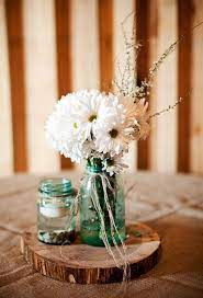 Place the roses in the center. Barn Wedding On A Budget Rustic Wedding Chic Rustic Wedding Centerpieces Rustic Country Wedding Wedding Table Centerpieces