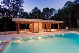 There's a pergola on the side featuring a romantic swing. Modern Pool House Modern Pool New York By Jablonski Associates Houzz Au