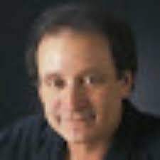 Debbie and Dale Booth in front of their farmhouse