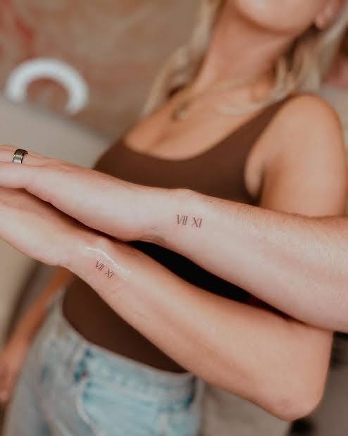 Roman Numerals Tiny Couple Tattoo | Fine Line Tattoo Ideas