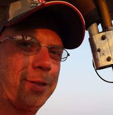 John Deere layoffs hit hard in Waterloo. Economists say tariffs and a  struggling farm economy are key factors.